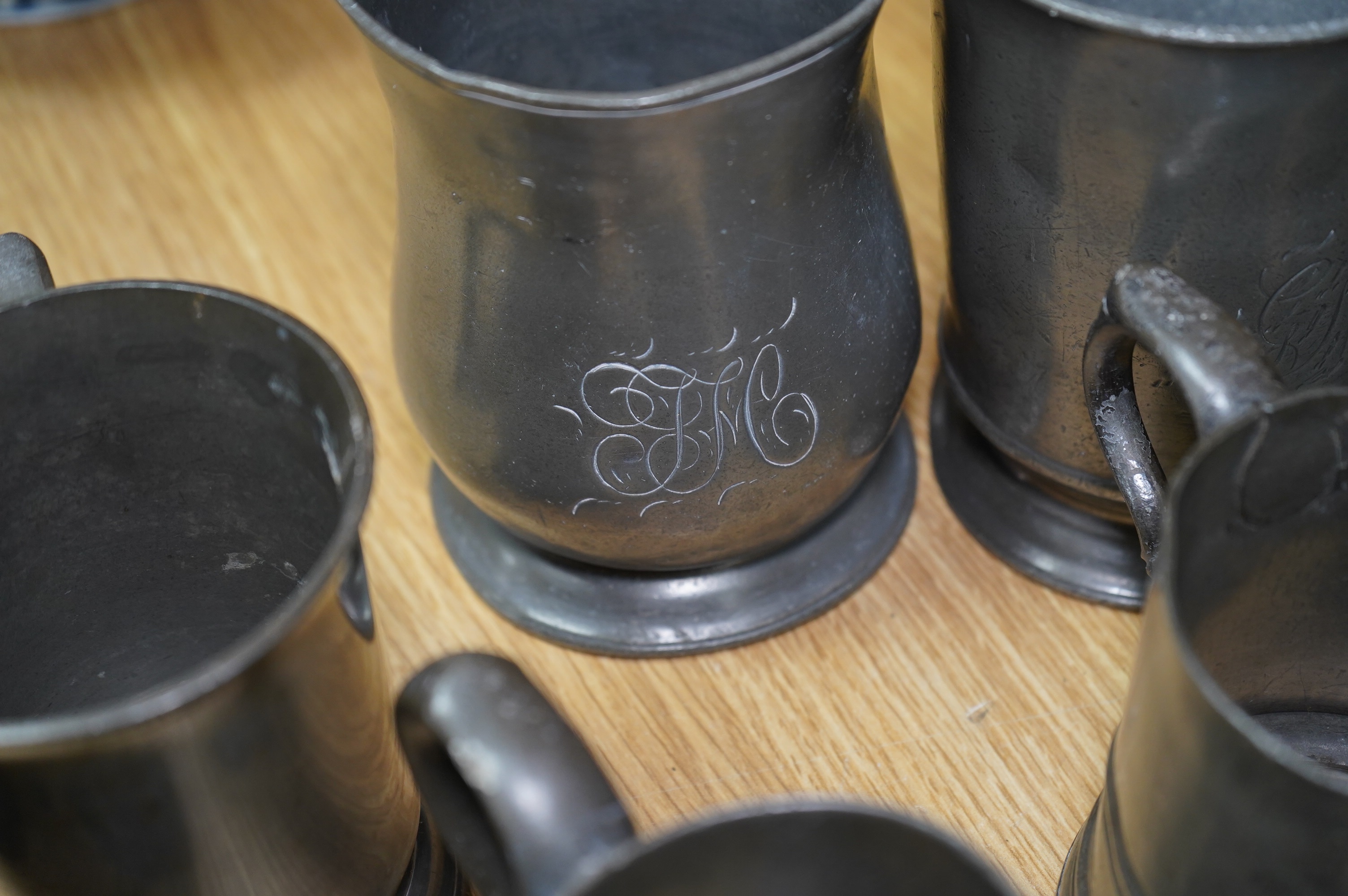 A collection of various pewter tankards, jugs etc. Condition - varies